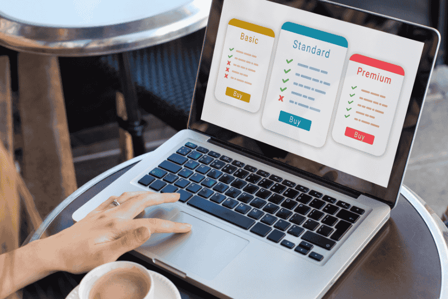Laptop screen showing subscription pricing tiers, representing auditing plans and downgrading recurring services