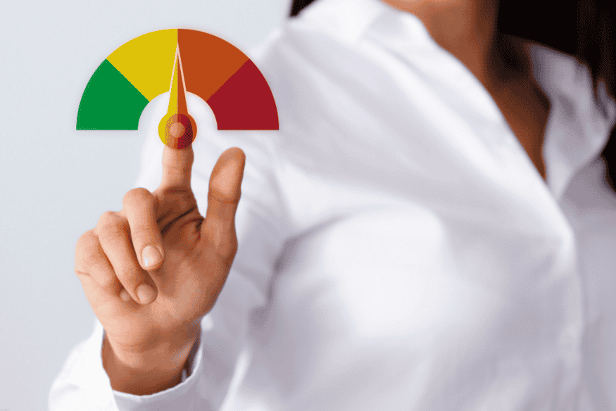 Woman in white shirt pointing at a credit score meter, highlighting the score improvement process.
